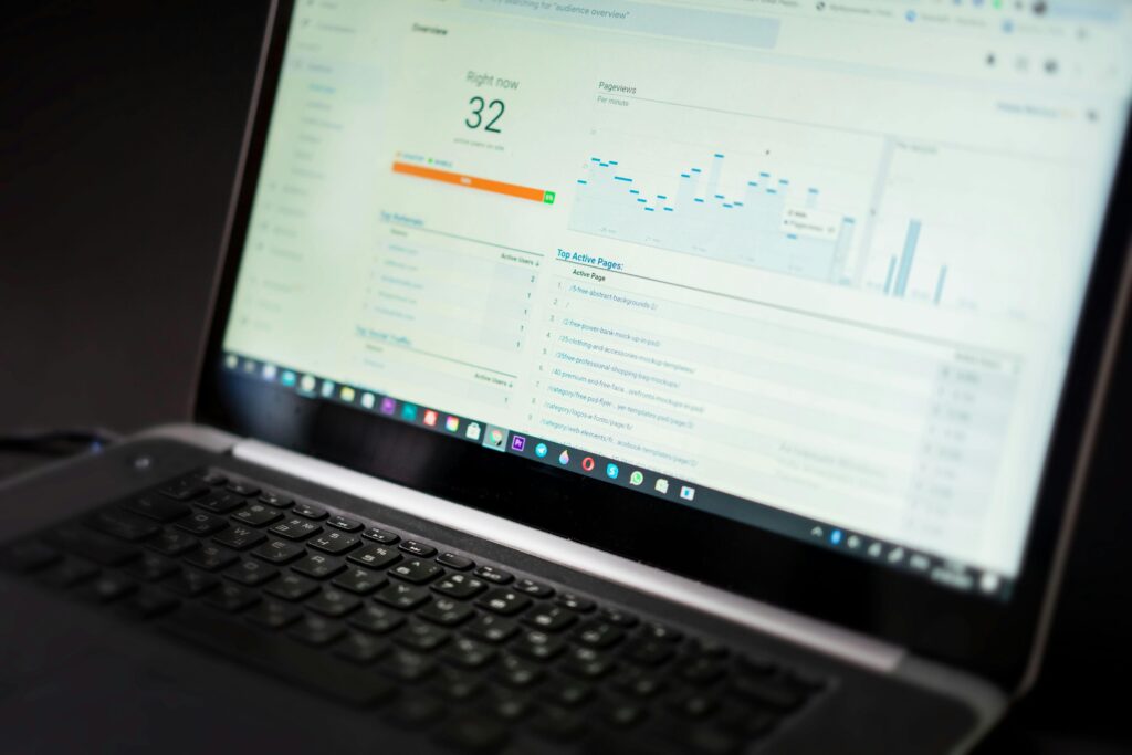 seo A laptop displaying an analytics dashboard with real-time data tracking and analysis tools.